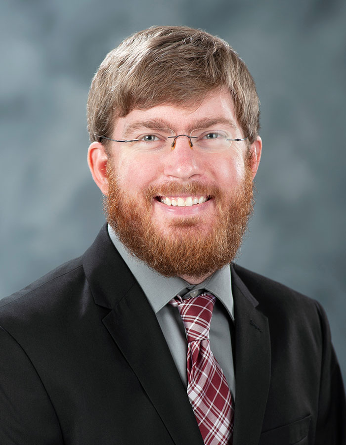 Formal studio headshot portrait of James Carskadon