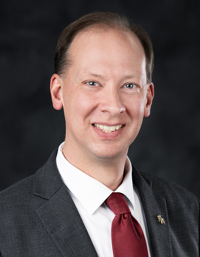 Formal studio headshot portrait of David Garraway