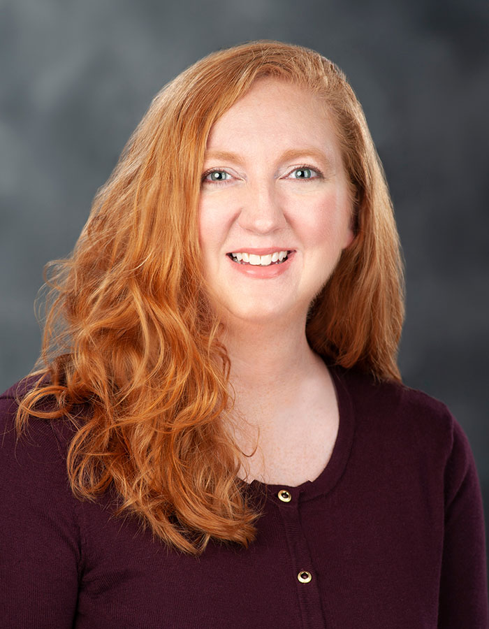 Formal studio headshot portrait of Susan Lassetter