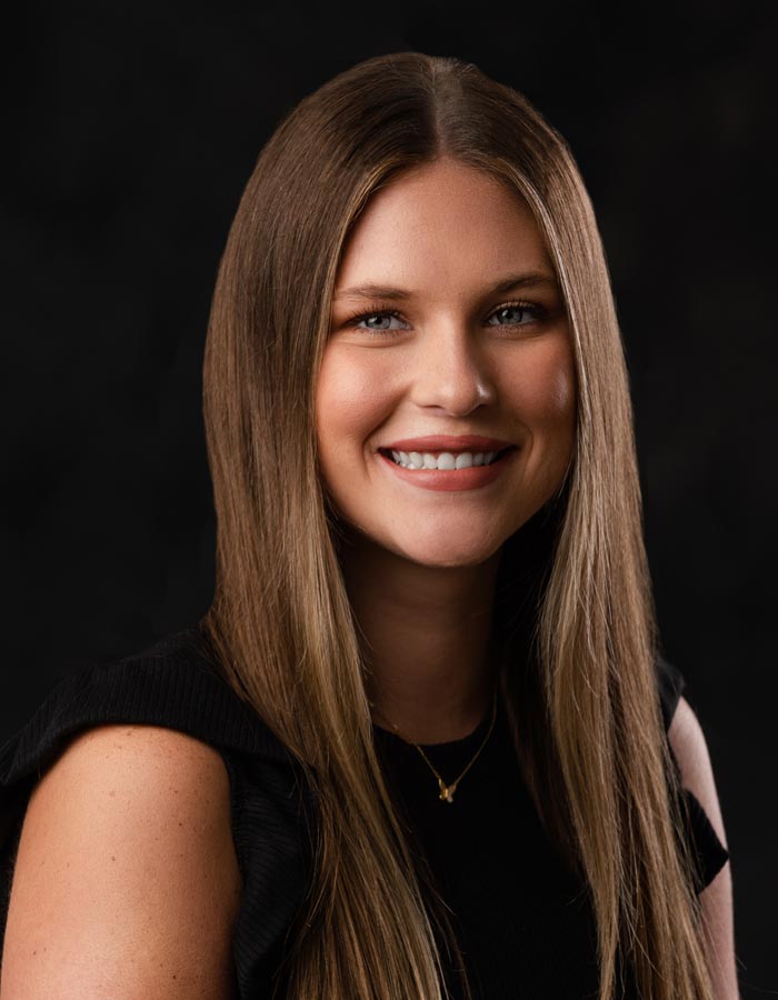 Formal studio headshot portrait of Sarah Gilliland