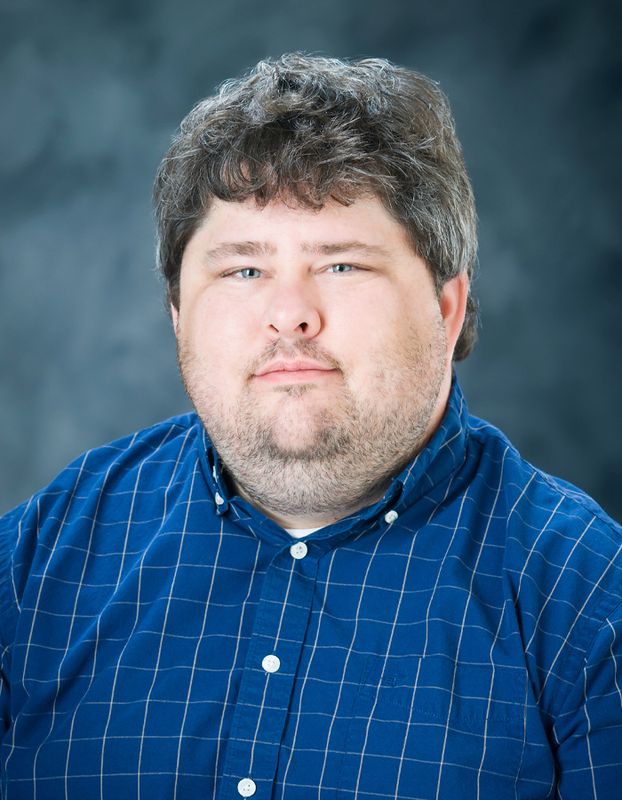 Formal studio headshot portrait of Carl Smith