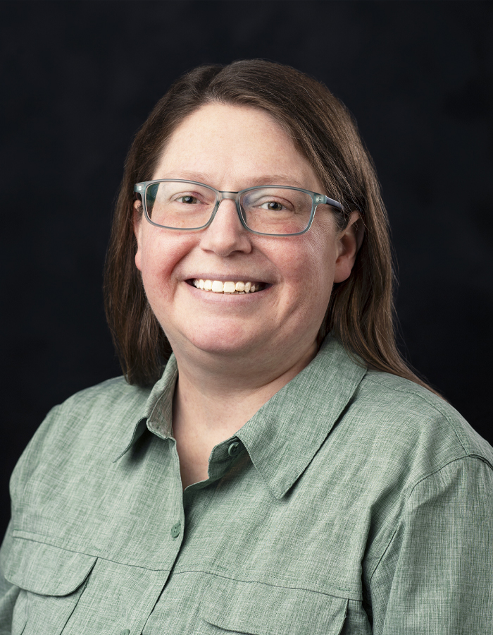 Formal studio headshot portrait of Beth Wynn